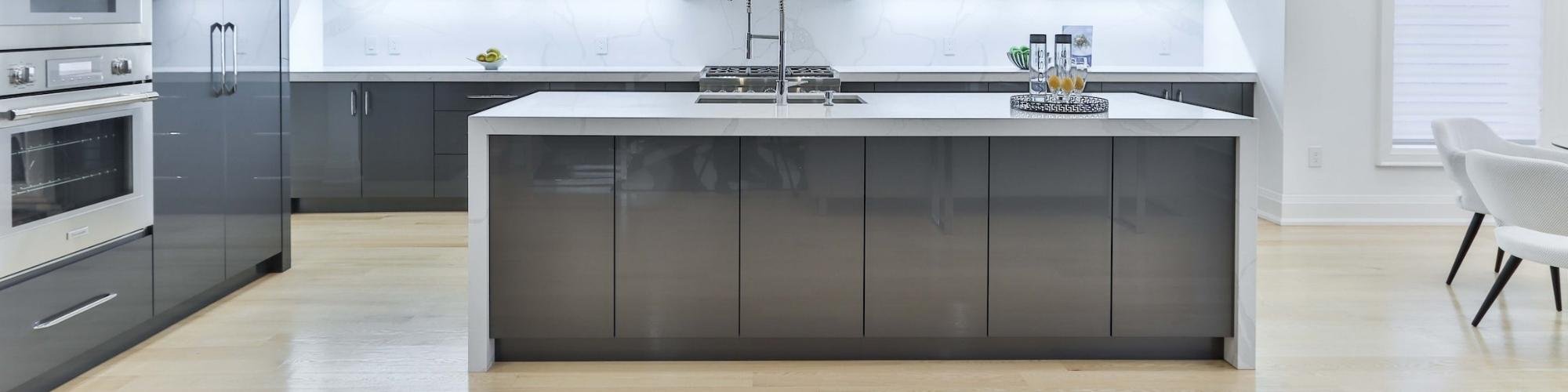 Open concept kitchen with light wood-look flooring